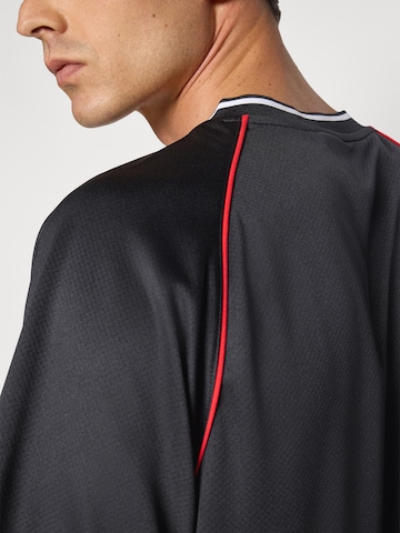 PUMA Performance shirt 'Essentials' in Black