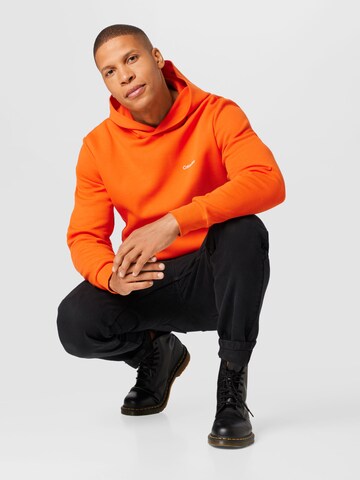 Calvin Klein Суичър в оранжево