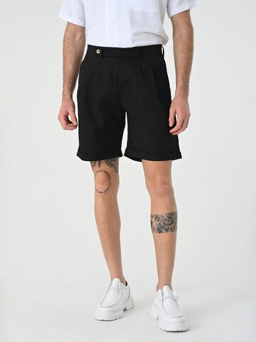 Antioch Regular Pleat-front trousers in Black: front