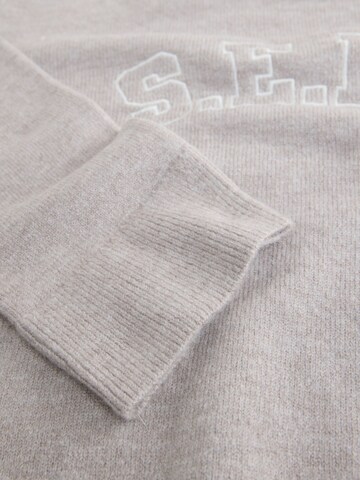 Pull-over self. en beige
