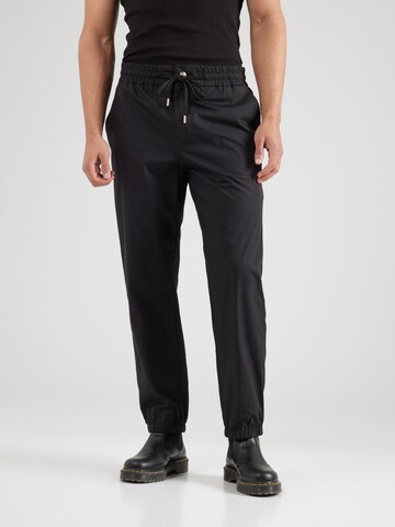 Tapered Pantaloni di Versace Jeans Couture in nero: frontale