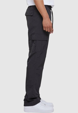 Urban Classics Loose fit Cargo Pants in Black