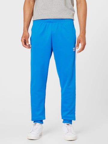 ADIDAS ORIGINALS Zwężany krój Spodnie 'Adicolor Classics Sst' w kolorze niebieski: przód