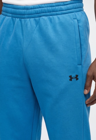 UNDER ARMOUR - Tapered Pantalón deportivo en azul