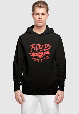Sweat-shirt 'Stranger Things - Friends Dont Lie' ABSOLUTE CULT en noir : devant