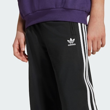 ADIDAS ORIGINALS Loose fit Trousers 'Adicolor' in Black
