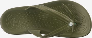 Flip-flops de la Crocs pe verde