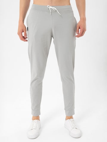 By Diess Collection Tapered Trousers in Grey: front