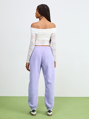 Nike Sportswear Конический (Tapered) Штаны 'PHNX FLC' в Лиловый: сзади