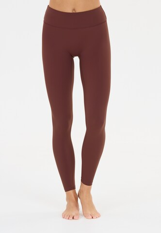 Athlecia Skinny Workout Pants 'Luxe' in Red: front