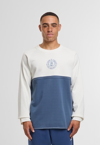 Felpa 'DMWU' di Unfair Athletics in blu: frontale