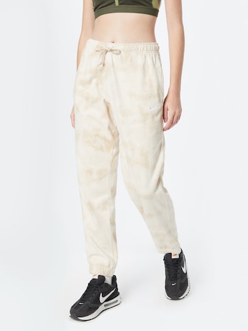 Nike Sportswear Tapered Pants in Beige: front