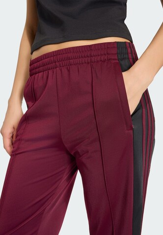 ADIDAS ORIGINALS Loosefit Kalhoty 'Adibreak' – červená