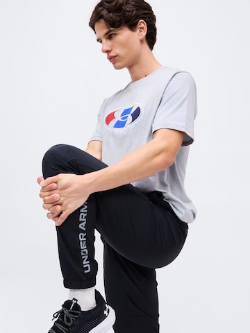 UNDER ARMOUR Tapered Sportbroek 'Tech Utility' in Zwart