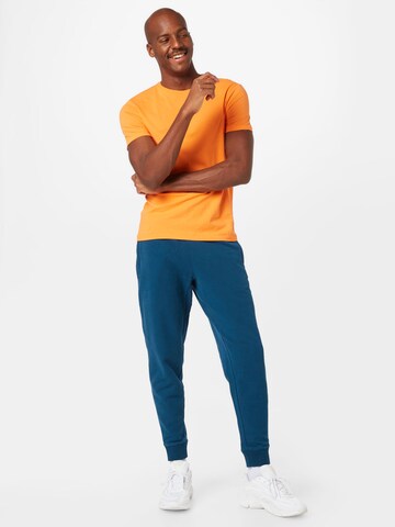 Superdry Tapered Nadrág - kék