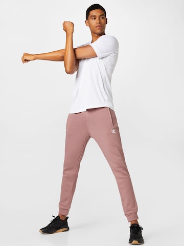 ADIDAS ORIGINALS Zwężany krój Spodnie 'Adicolor Essentials Trefoil' w kolorze różowy