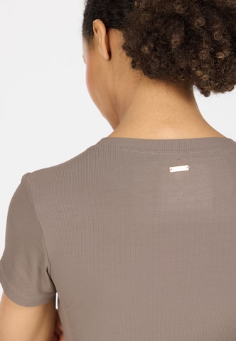 Athlecia Functioneel shirt 'Tinashe' in Bruin