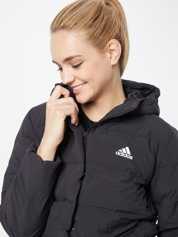 ADIDAS SPORTSWEAR Between-Season Jacket 'Helionic Down' in Black