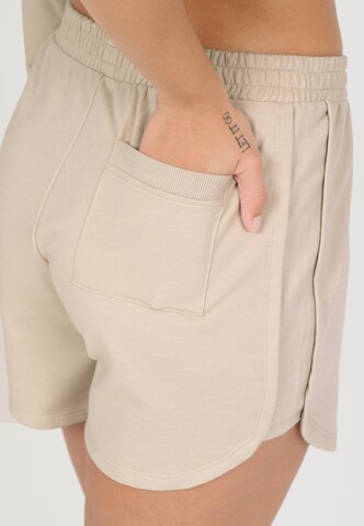 NOU Loose fit Trousers 'Vacay' in Beige