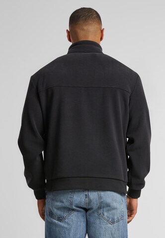 Giacca di pile di Urban Classics in nero