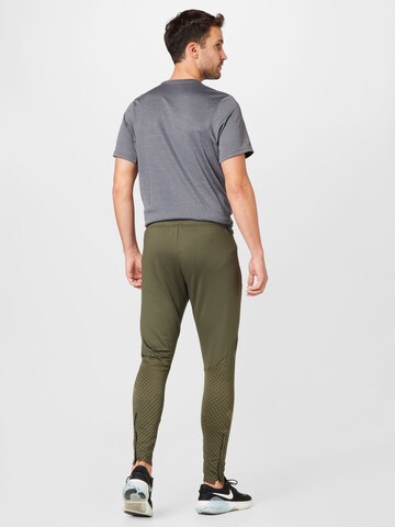 NIKE Regular Workout Pants 'Strike' in Green