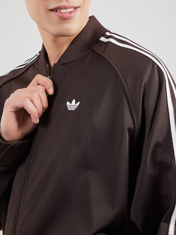 ADIDAS ORIGINALS Prehodna jakna 'BRITCORE' | rjava barva