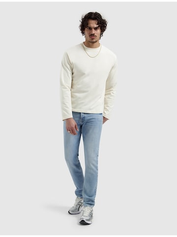 Pure Path Tapered Jeans in Blue: front