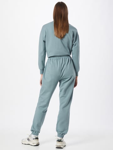 ABOUT YOU Tapered Pants 'Naomi Sweat Pants' in Green