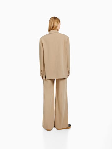 Bershka Wide leg Pressveckad byxa i beige