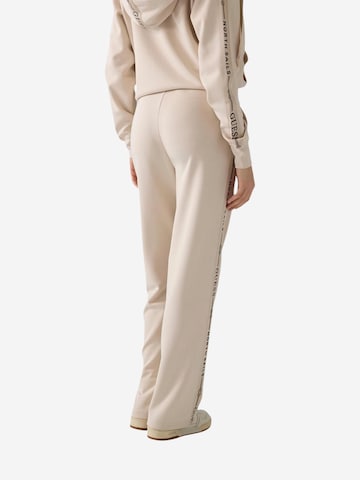 GUESS - Pierna ancha Pantalón deportivo 'GUESSXNS SWEAT PANTS W6GB29 K3282' en beige