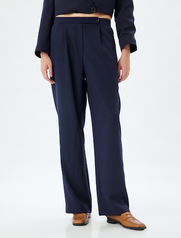 Koton Loose fit Pleat-front trousers in Blue: front