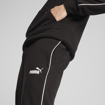 PUMA Tapered Sportbroek in Zwart