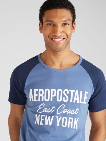 AÉROPOSTALE Tričko 'EAST COAST' – modrá