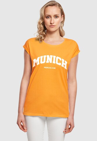 Merchcode T-Shirt 'Munich' in Orange: Vorderseite