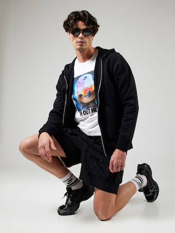 Loosefit Pantalon cargo Nike Sportswear en noir