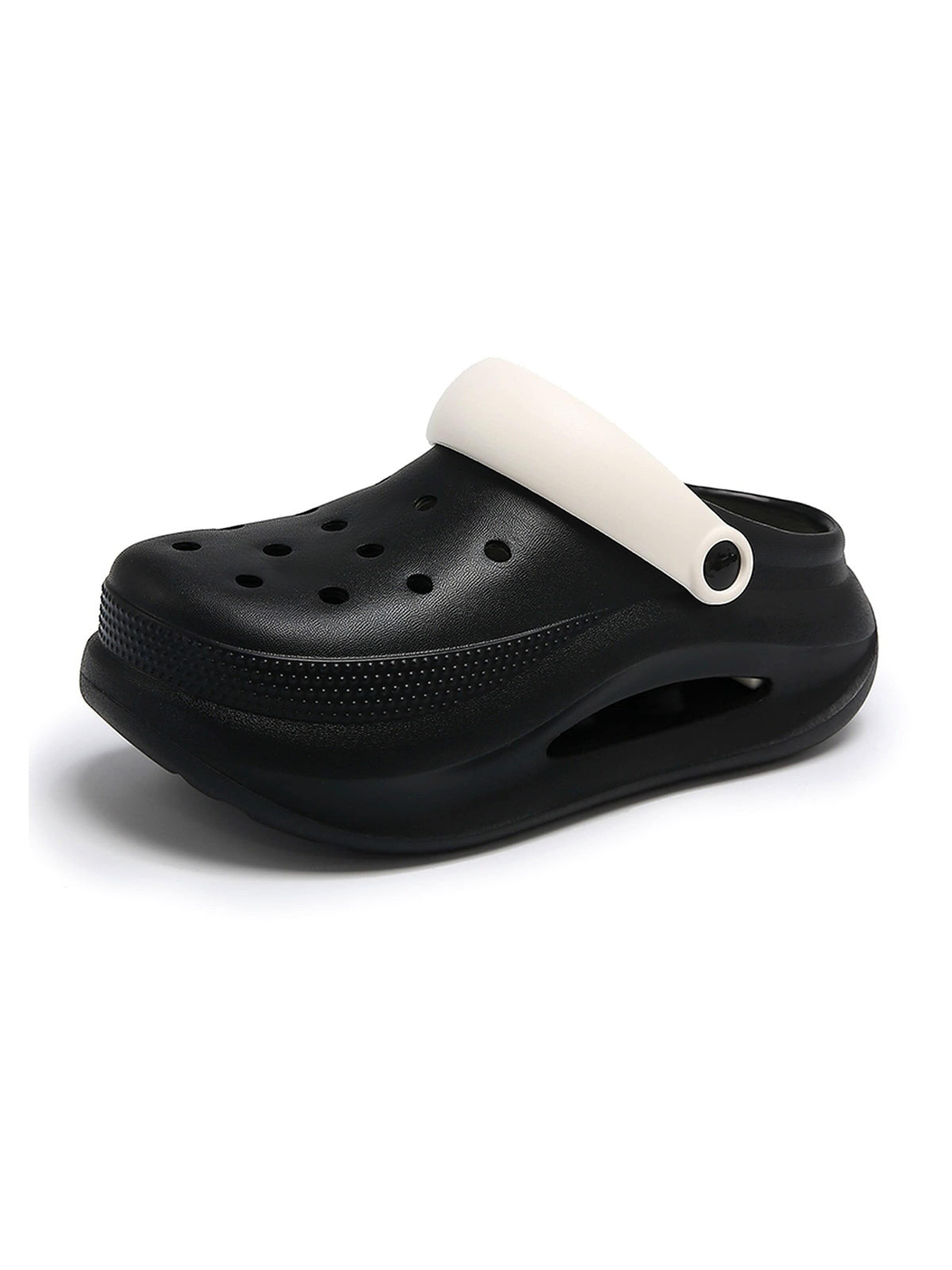 HUSKSWARE Clogs in Black: front