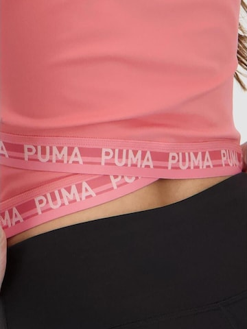 Maglietta 'Puma W Strong Cross Back Tee' di PUMA in rosa