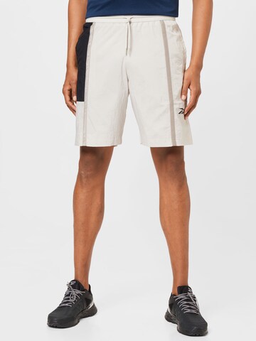 Reebok Regular Workout Pants in Beige: front