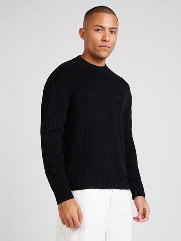 Pull-over Calvin Klein Jeans en noir : devant