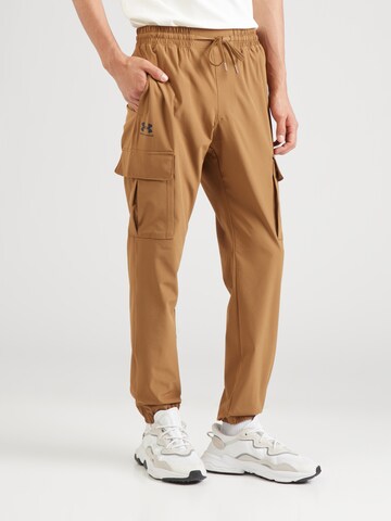 Effilé Pantalon de sport 'Vibe' UNDER ARMOUR en marron : devant