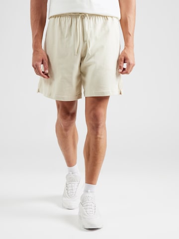 Nike Sportswear Loosefit Bukser 'CLUB' i grøn: forside