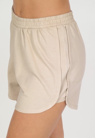 NOU Loose fit Trousers 'Vacay' in Beige