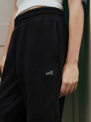 Next - Tapered Pantalón en negro