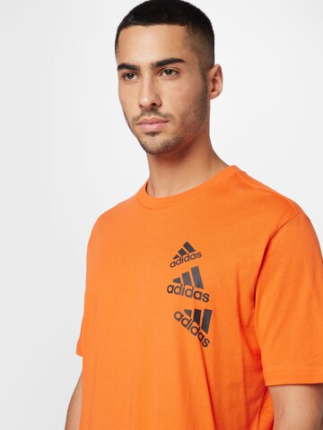 T-Shirt fonctionnel 'Essentials Brandlove' ADIDAS SPORTSWEAR en orange