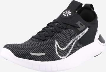 NIKE - Zapatillas de running en negro: frente