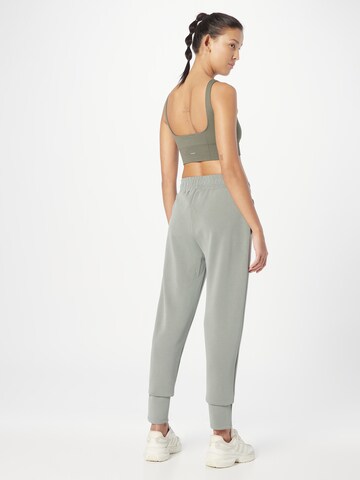 Athlecia Tapered Sporthose in Grün