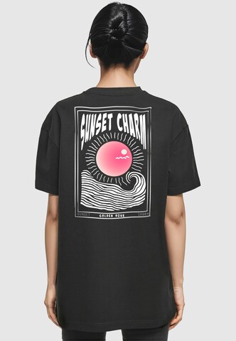 Merchcode Oversizeshirt 'Sunset Charm' in Schwarz: Vorderseite