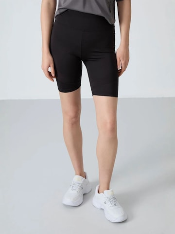 Tommy Life - Tapered Leggings 'Gamaschen' em preto