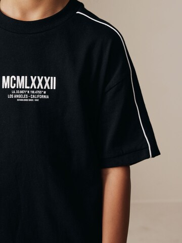 Next Majica | črna barva