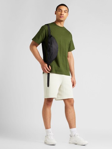 Nike Sportswear Ohlapna forma Hlače | siva barva